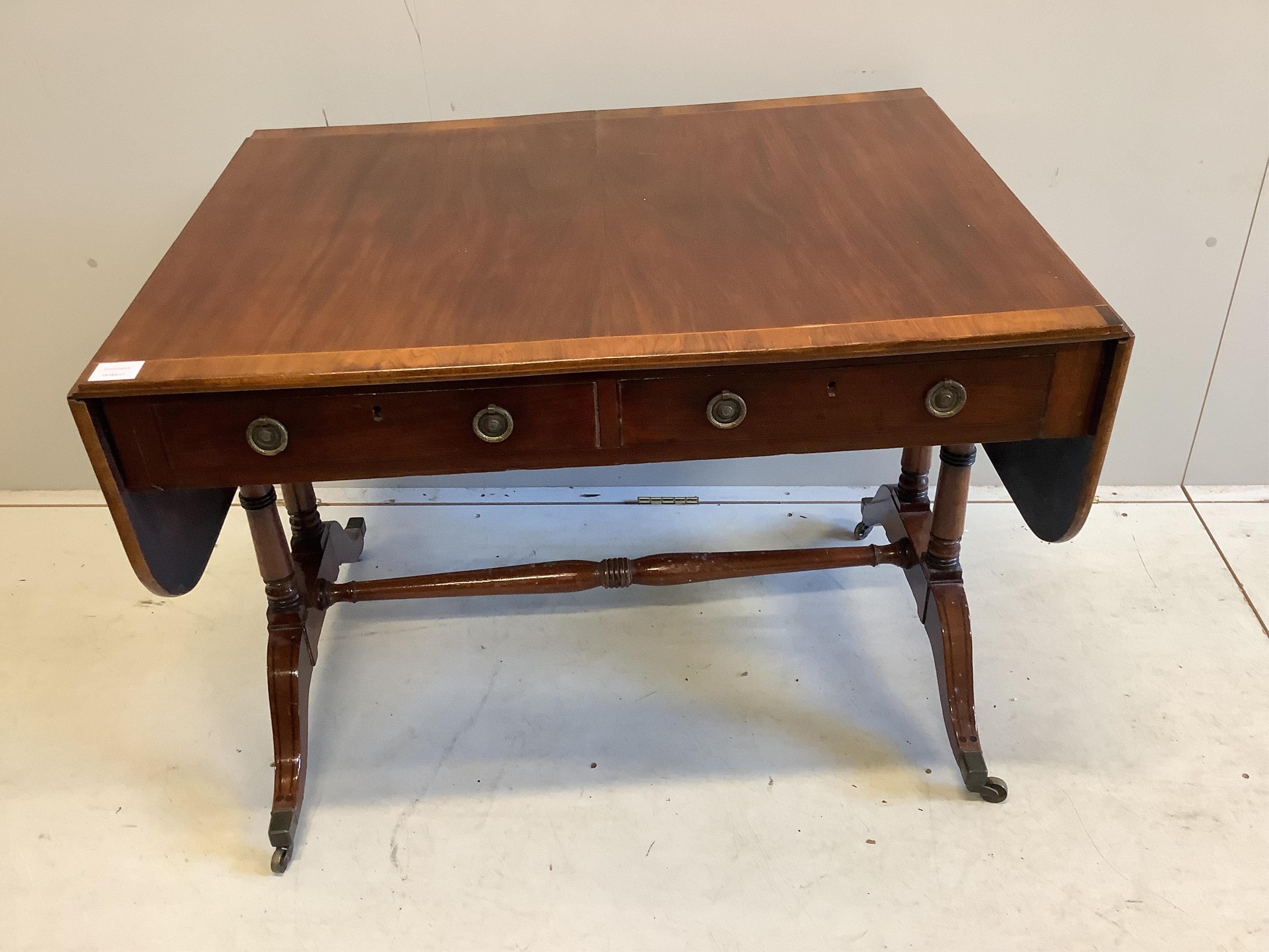 A Regency banded mahogany sofa table, width 94cm, depth 70cm, height 70cm. Condition - fair